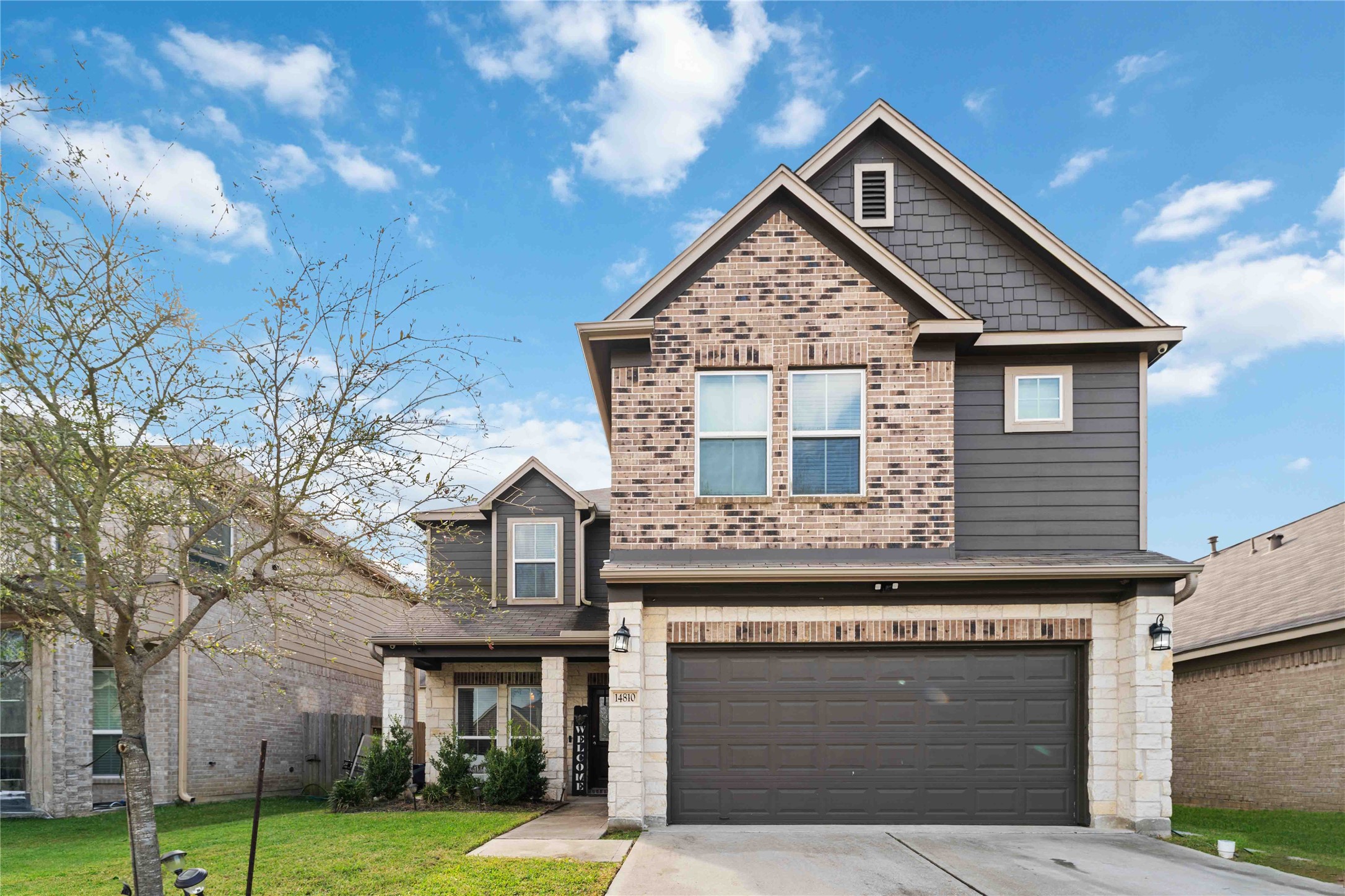 14810 Ruddy Duck Lane Houston, TX 77049 - Photo 3 of 33 a front view of a house with garden