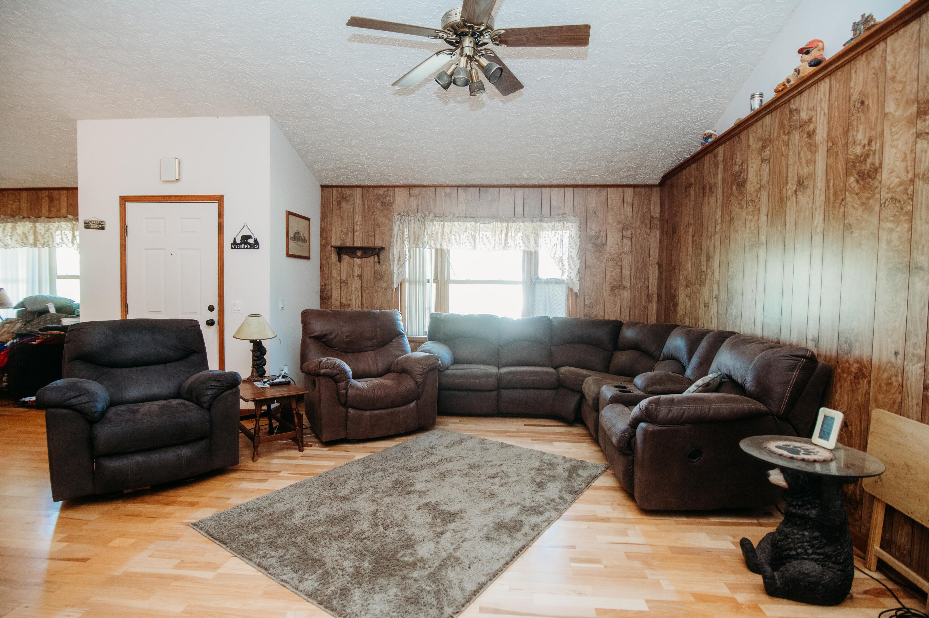 3197 Lee Elgin Road Woolwine, VA 24185 - Photo 25 of 46 a living room with furniture and a chandelier