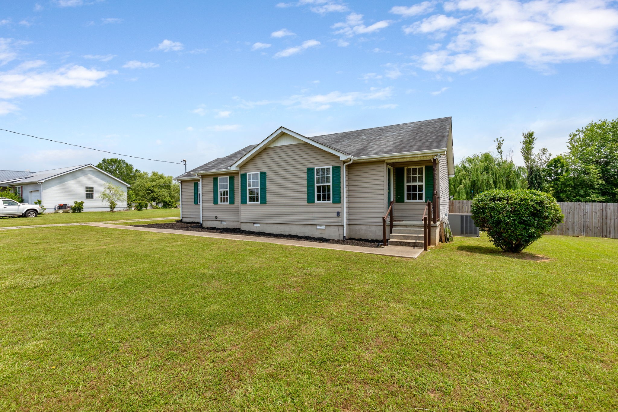 a front view of a house with yard