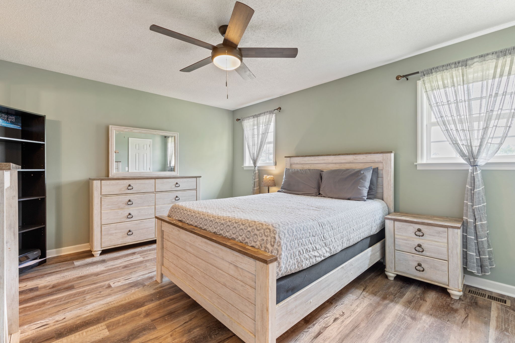 889 6 Mile Board Road Belvidere, TN 37306 - Photo 14 of 27 a bedroom with a bed and a chandelier