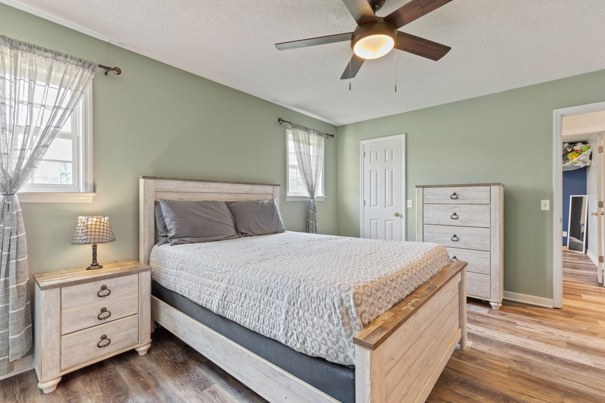 889 6 Mile Board Road Belvidere, TN 37306 - Photo 15 of 27 a bedroom with a bed and a chandelier