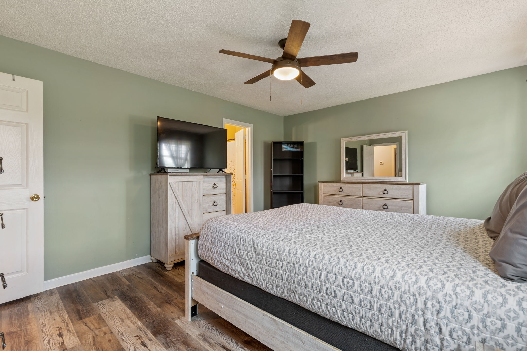 889 6 Mile Board Road Belvidere, TN 37306 - Photo 16 of 27 a bedroom with a bed and a flat screen tv