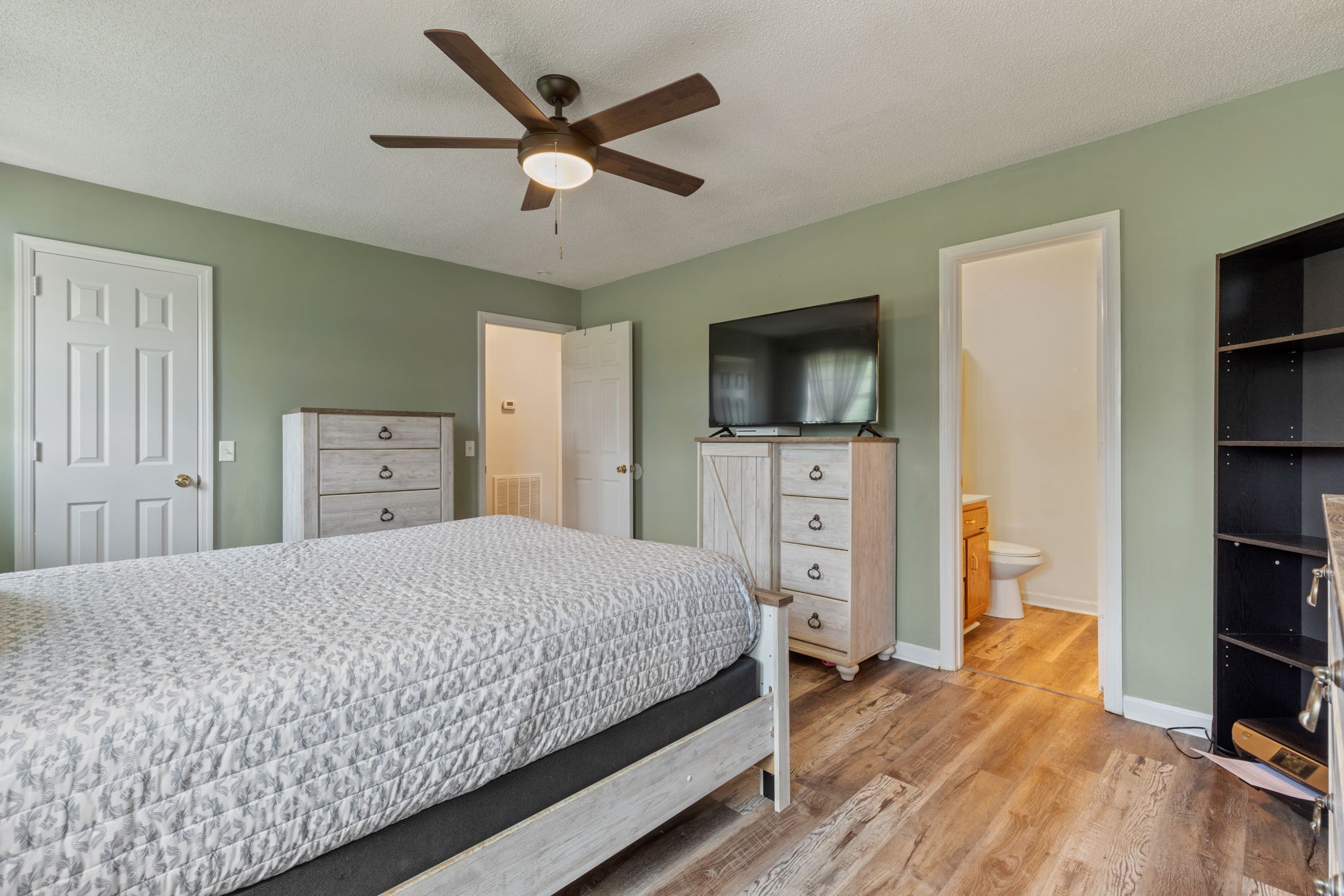 889 6 Mile Board Road Belvidere, TN 37306 - Photo 17 of 27 a bedroom with a bed and a flat screen tv