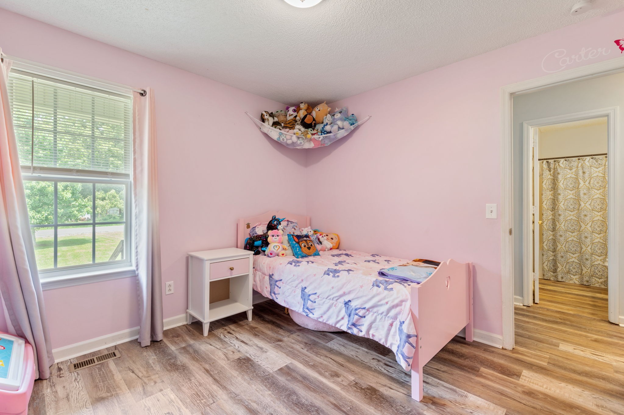 889 6 Mile Board Road Belvidere, TN 37306 - Photo 23 of 27 a bedroom with a bed and a window