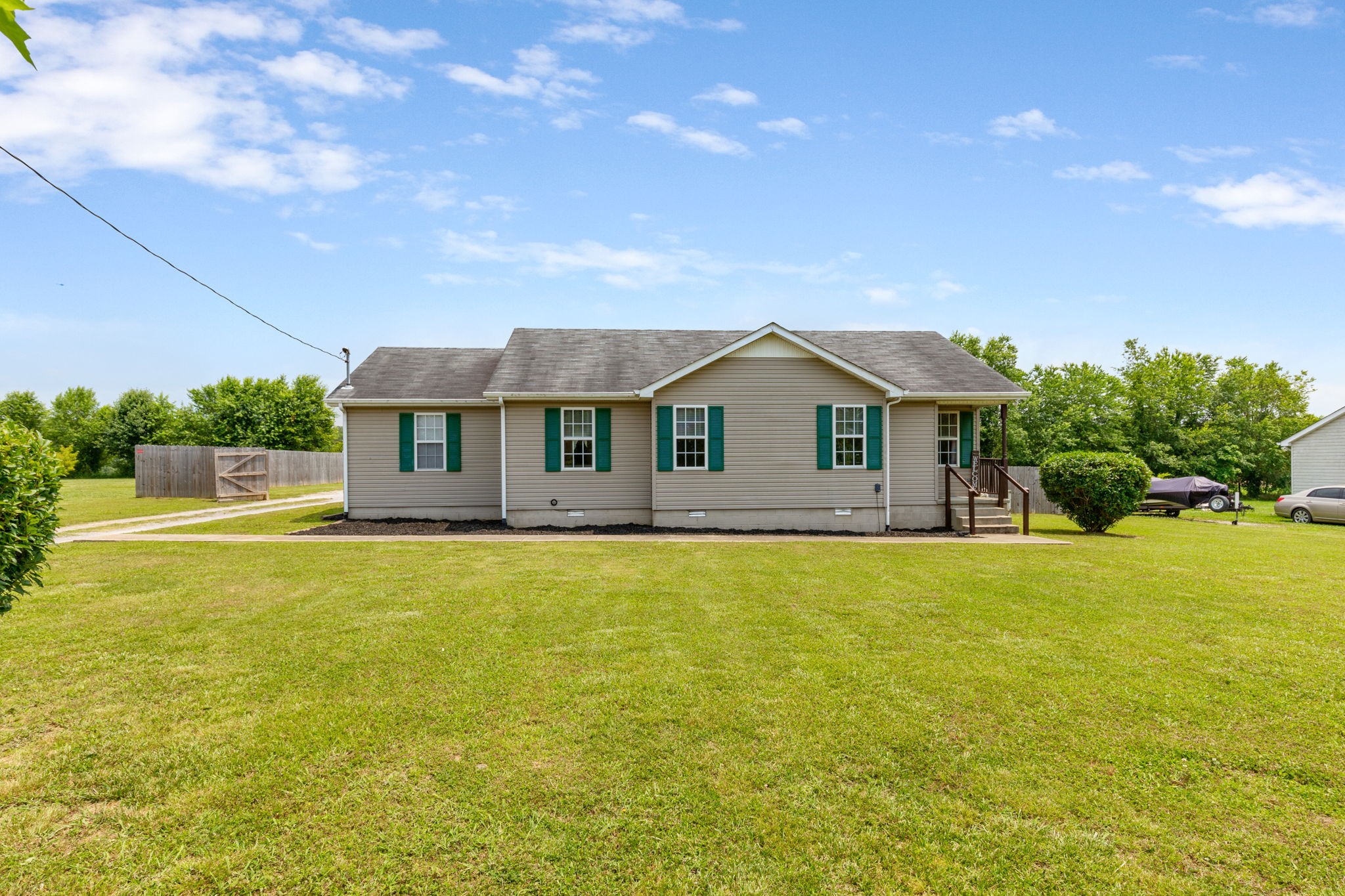 889 6 Mile Board Road Belvidere, TN 37306 - Photo 3 of 27 a front view of house with swimming pool and green space