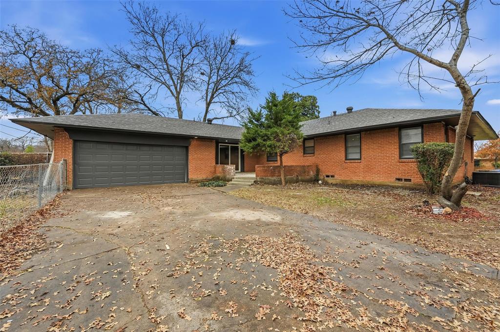 816 Green Cove Lane Dallas, TX 75232 - Photo 22 of 24 a front view of a house with garden