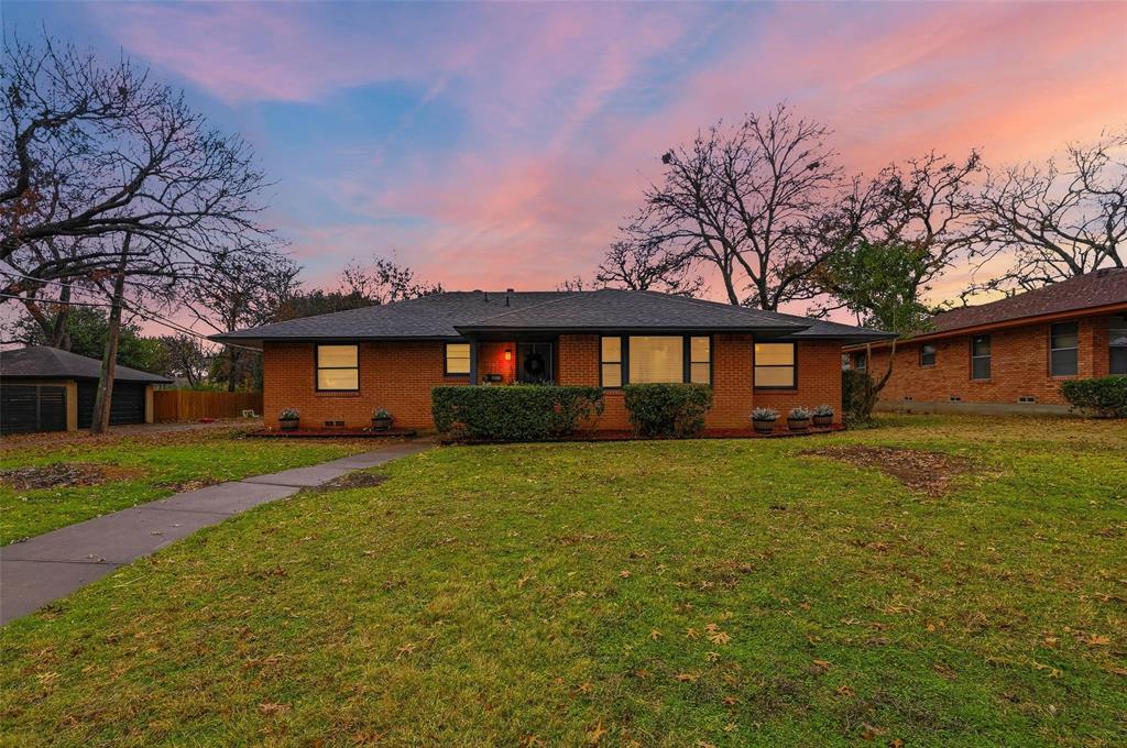 816 Green Cove Lane Dallas, TX 75232 - Photo 5 of 24 a front view of a house with a yard