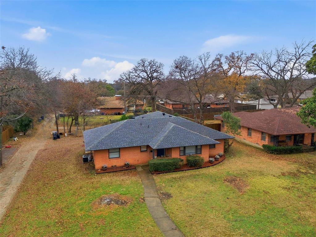 816 Green Cove Lane Dallas, TX 75232 - Photo 6 of 24 an aerial view of residential houses with yard and mountain view in back