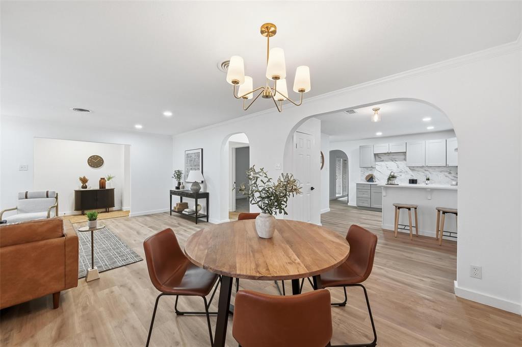 816 Green Cove Lane Dallas, TX 75232 - Photo 9 of 24 a view of a dining room with furniture and wooden floor