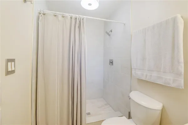 an aerial view of a house with swimming pool garden and patio