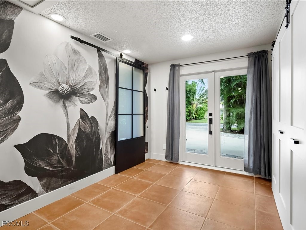 1046 Sperling Avenue Naples, FL 34103 - Photo 2 of 18 a very nice looking room with a large window