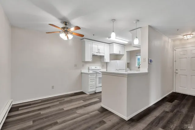 a kitchen with sink a microwave and stove