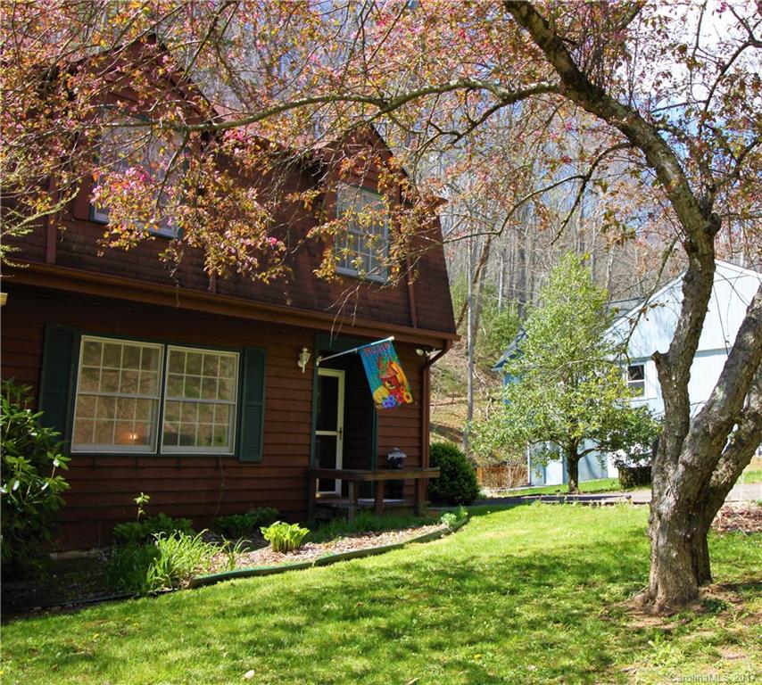 303 Riddle Cove Road, Unit 330 Maggie Valley, NC 28751 - Photo 1 of 24 front view of a house with a yard