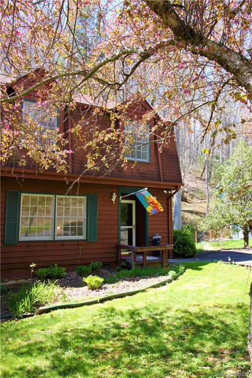 303 Riddle Cove Road, Unit 330 Maggie Valley, NC 28751 - Photo 2 of 24 front view of a house with a yard