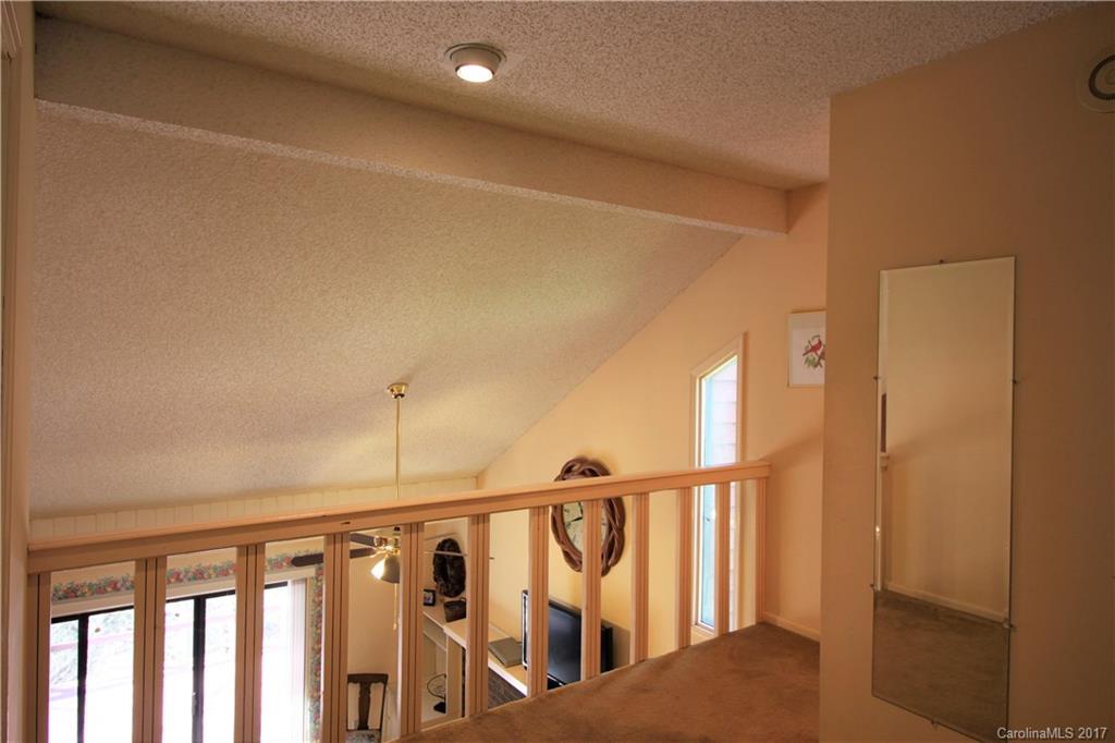 303 Riddle Cove Road, Unit 330 Maggie Valley, NC 28751 - Photo 11 of 24 a view of staircase with lots of wooden floor
