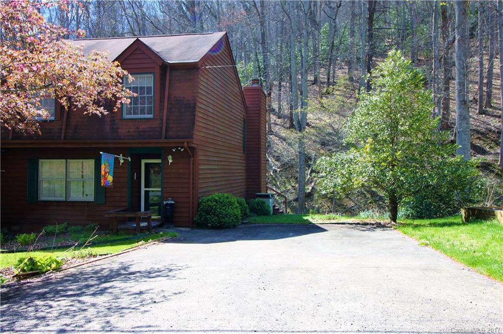 303 Riddle Cove Road, Unit 330 Maggie Valley, NC 28751 - Photo 24 of 24 a front view of a house with garden