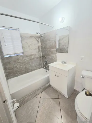 a bathroom with a sink a toilet and a bathtub