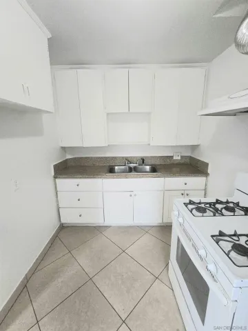 a kitchen with cabinets and appliances