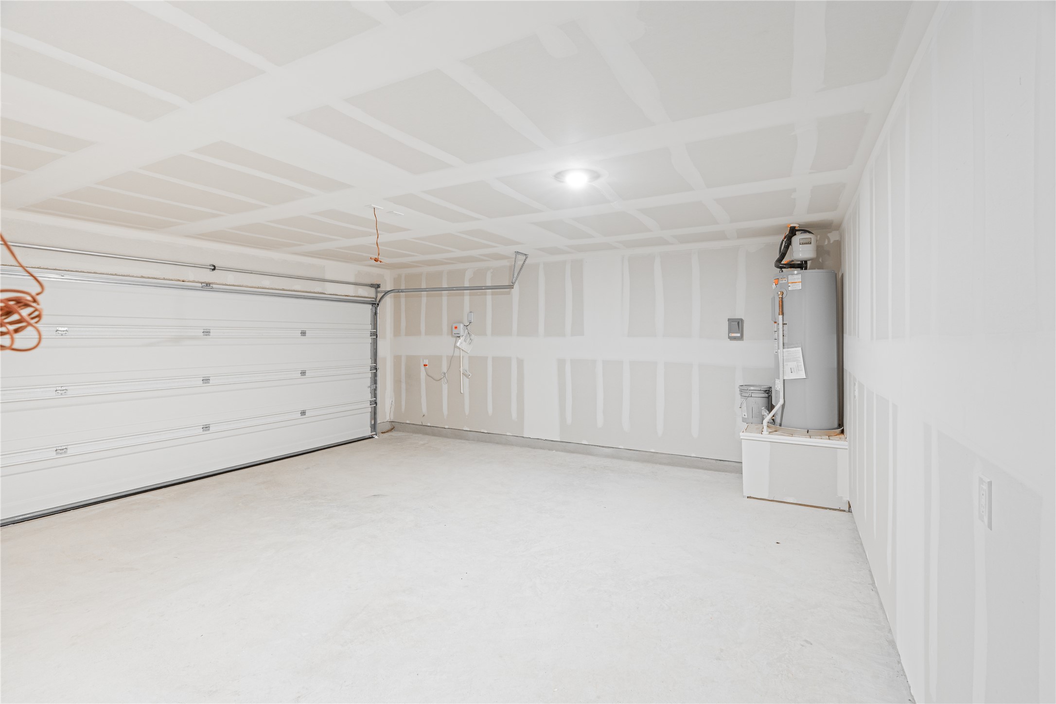 117 Dark Victory Road Jarrell, TX 76537 - Photo 21 of 24 Garage with water heater