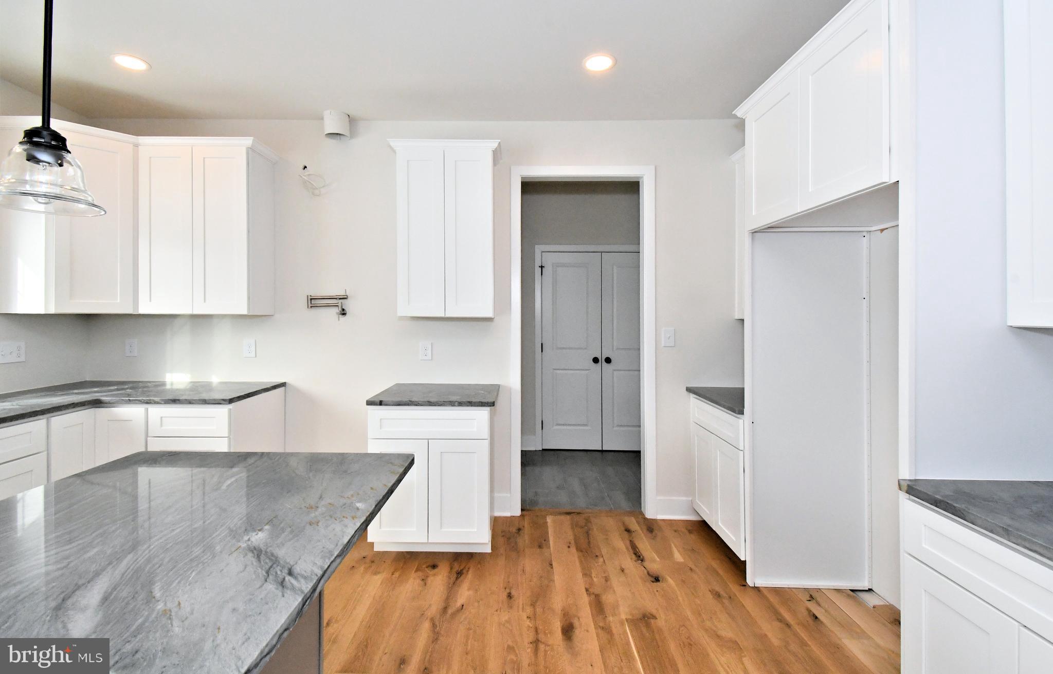 36 Hockle Road Schwenksville, PA 19473 - Photo 13 of 62 a kitchen with wooden floor and a sink