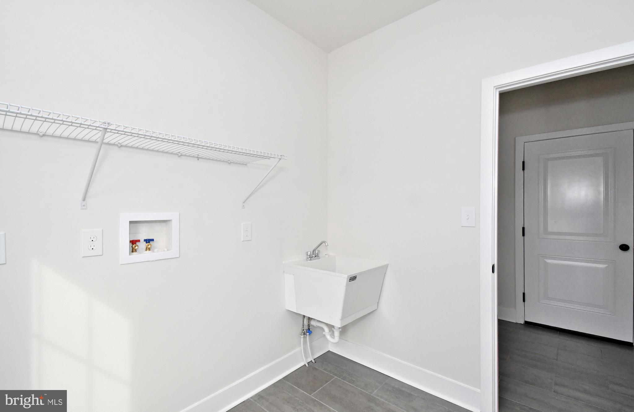 36 Hockle Road Schwenksville, PA 19473 - Photo 18 of 62 a view of a hallway with wooden floor and a cabinet