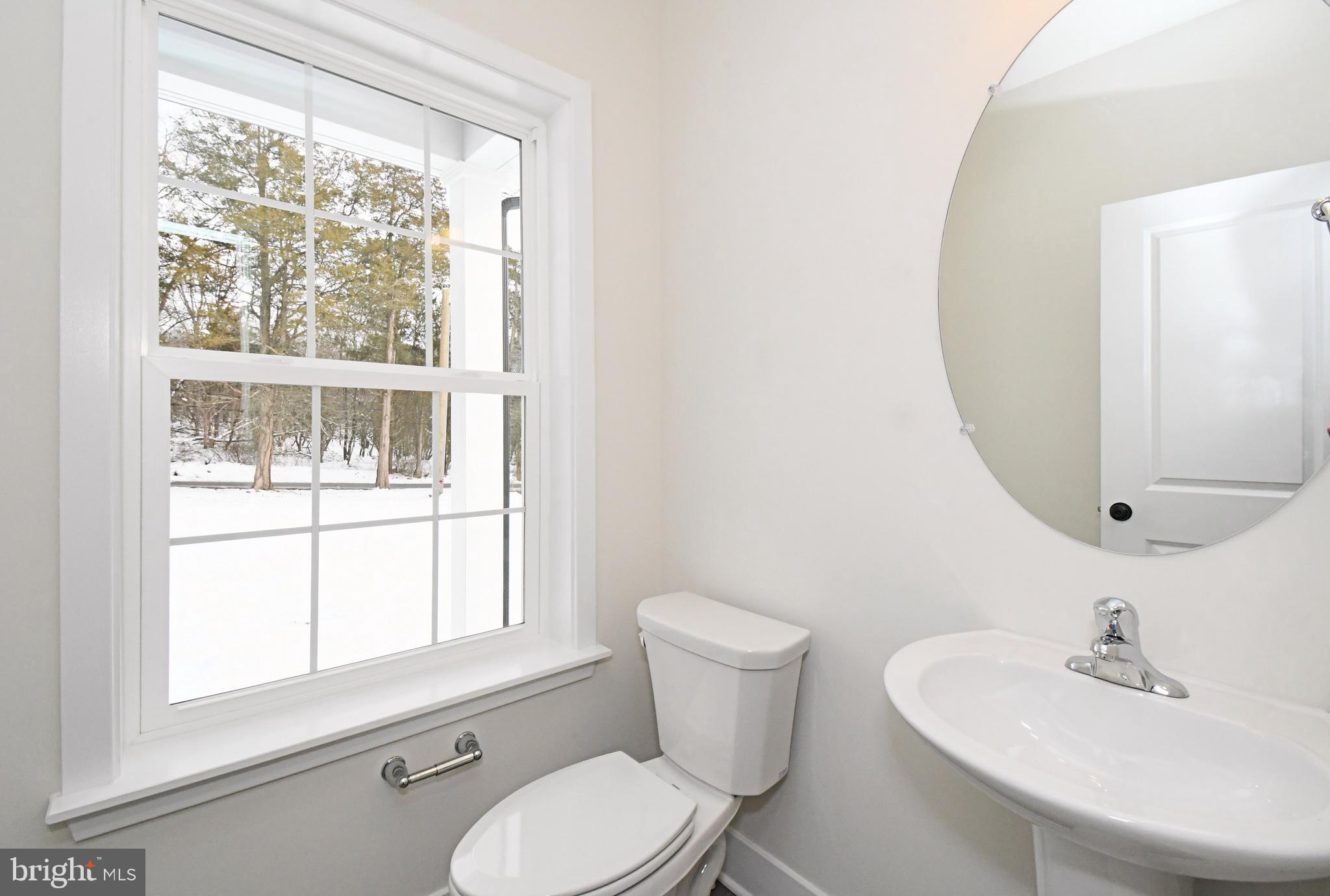 36 Hockle Road Schwenksville, PA 19473 - Photo 24 of 62 a bathroom with a toilet sink and mirror