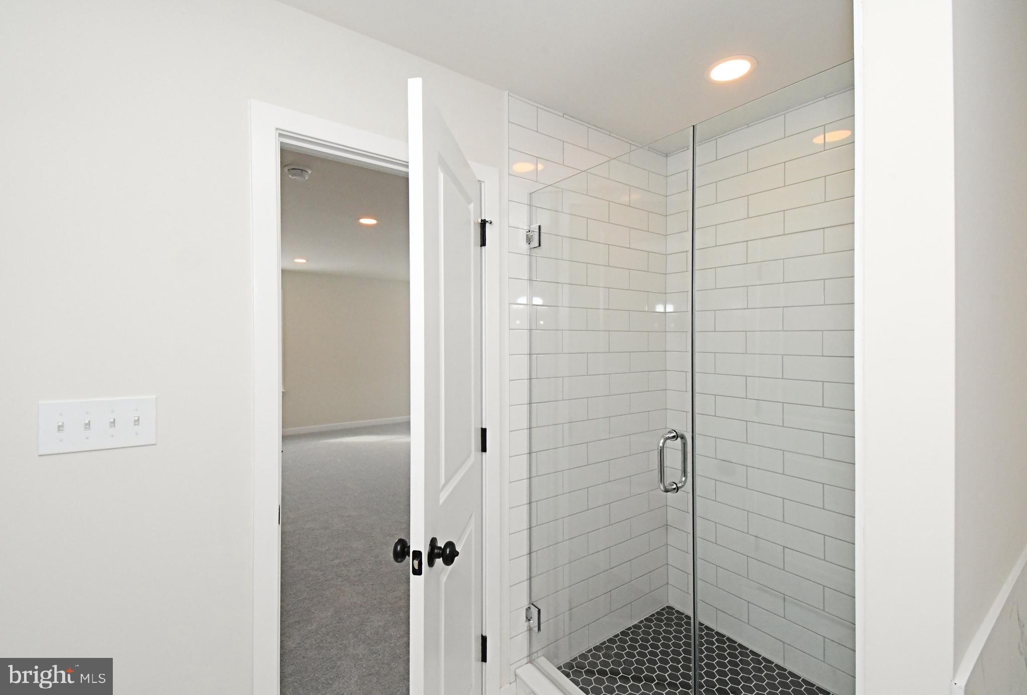 36 Hockle Road Schwenksville, PA 19473 - Photo 36 of 62 a bathroom with a shower and a sink