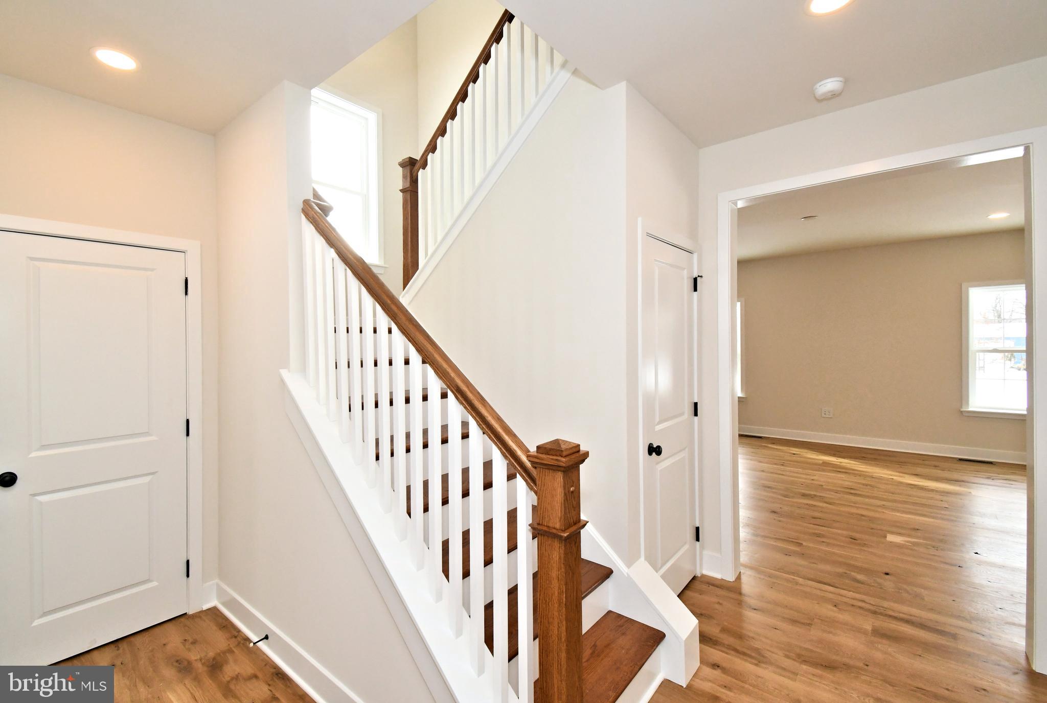 36 Hockle Road Schwenksville, PA 19473 - Photo 4 of 62 a view of a hallway with wooden floor and staircase