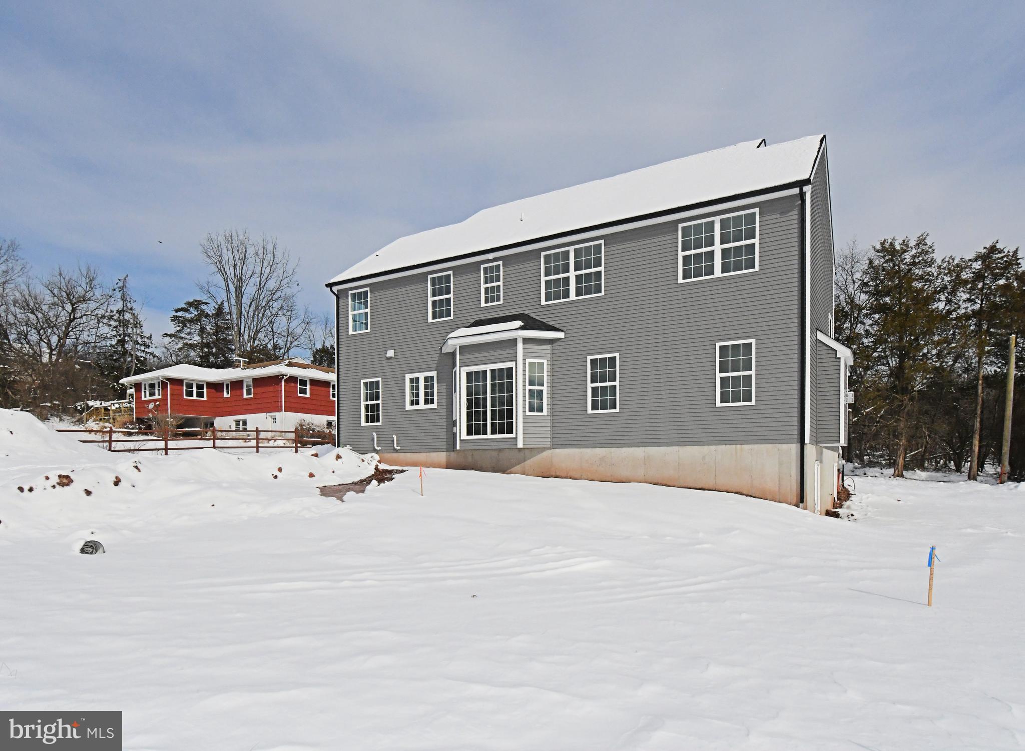 36 Hockle Road Schwenksville, PA 19473 - Photo 56 of 62 a backyard of a house with yard and retail shops
