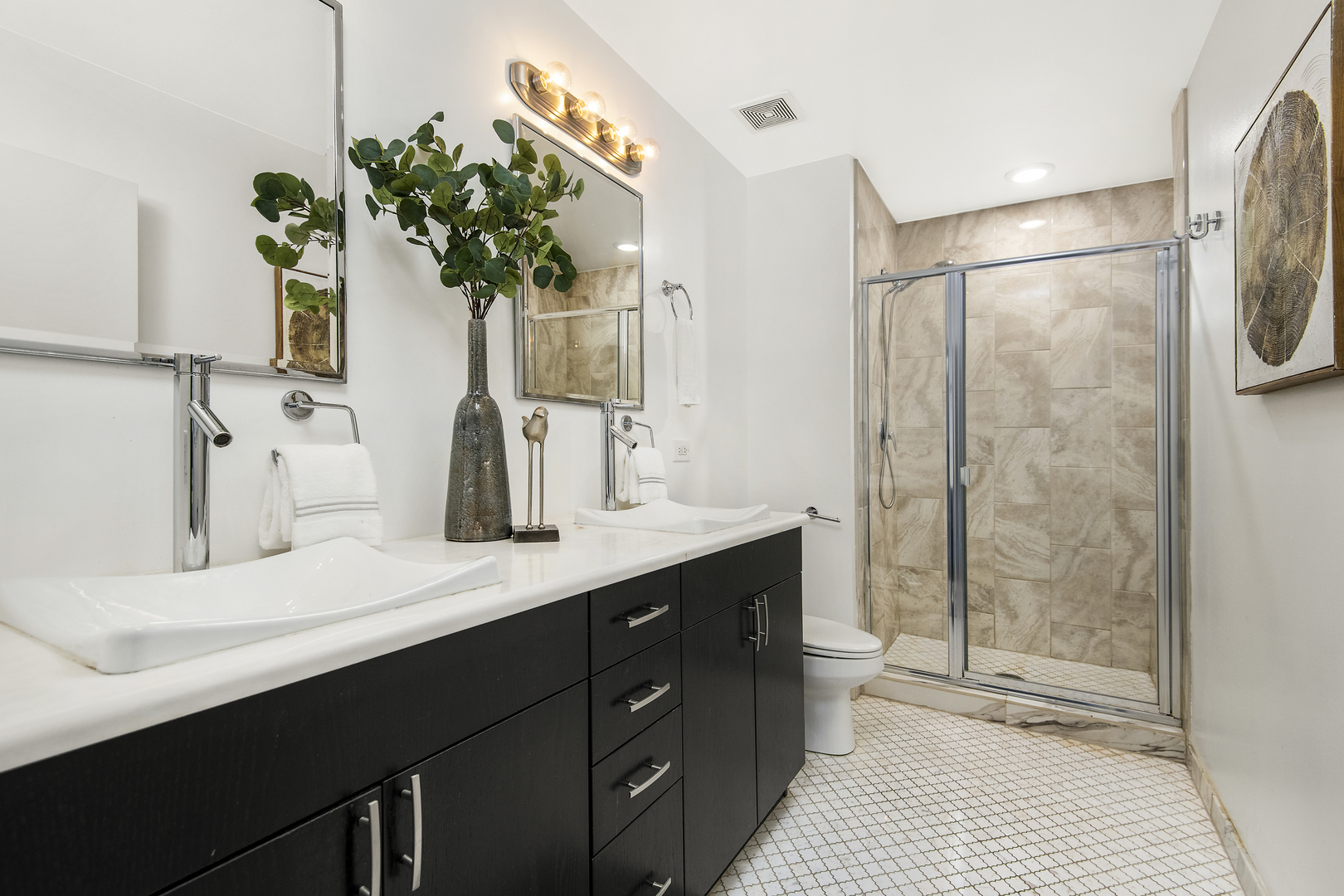 123 South Green Street, Unit 903B Chicago, IL 60607 - Photo 12 of 22 a bathroom with a sink a toilet and shower