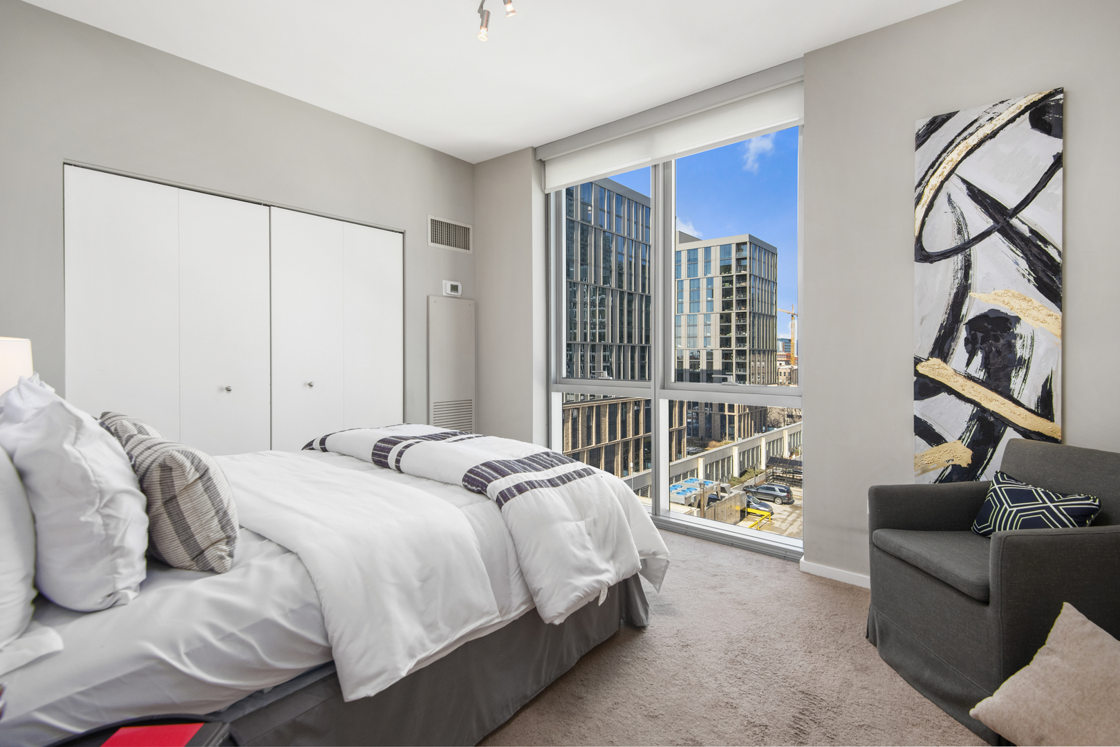 123 South Green Street, Unit 903B Chicago, IL 60607 - Photo 14 of 22 a bedroom with bed and a window