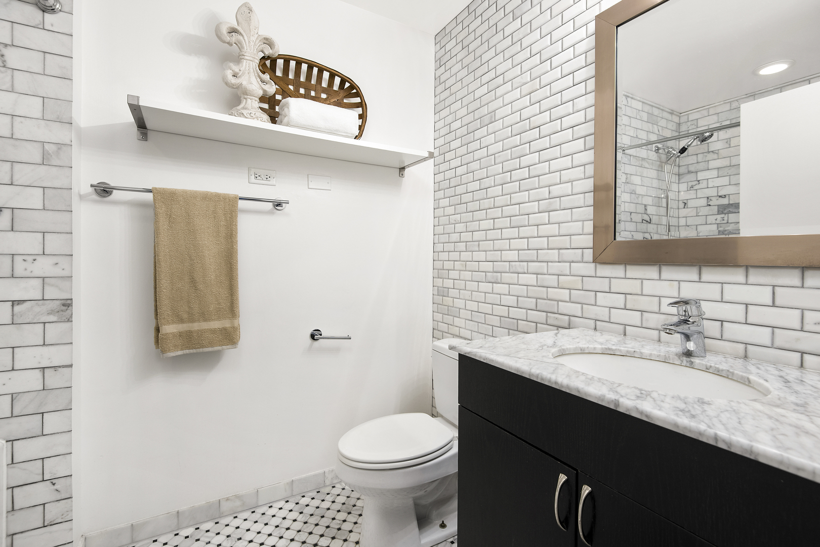 123 South Green Street, Unit 903B Chicago, IL 60607 - Photo 15 of 22 a bathroom with a sink a toilet and a mirror