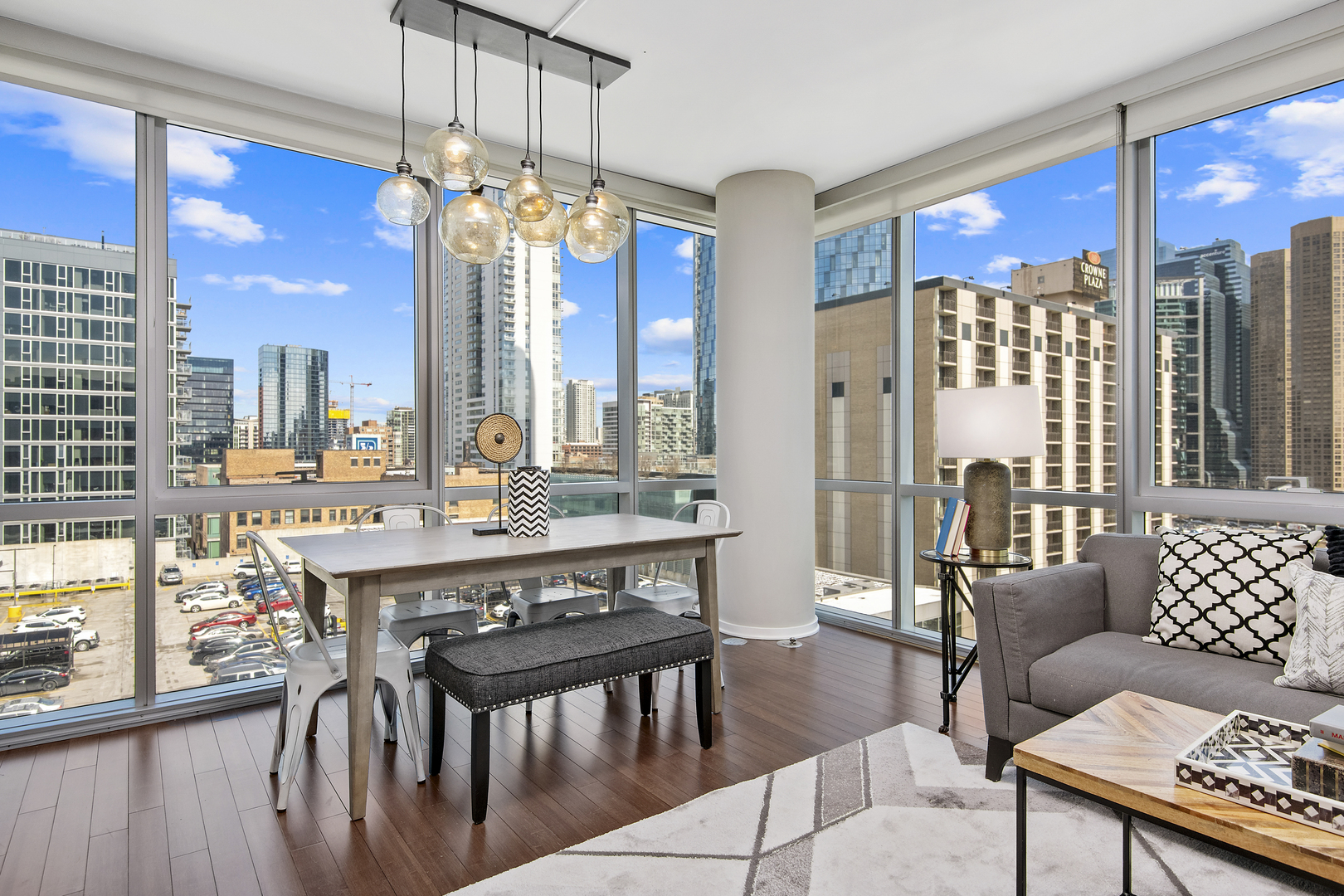 123 South Green Street, Unit 903B Chicago, IL 60607 - Photo 6 of 22 a view of a dining room with furniture wooden floor and chandelier