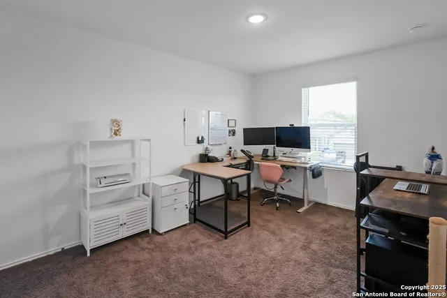 a view of a workspace with furniture