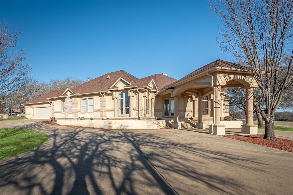 5555 Blagg Road Denton, TX 76208 - Photo 1 of 1 a front view of a house with a yard