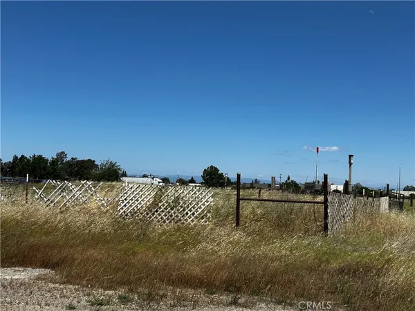 a view of a house with a yard and garage