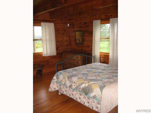 640 Yankee Hill Road Ischua, NY 14743 - Photo 6 of 16 Bedroom. One of two downstairs bedrooms.