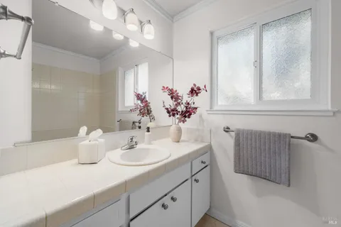 a bathroom with a sink and a mirror