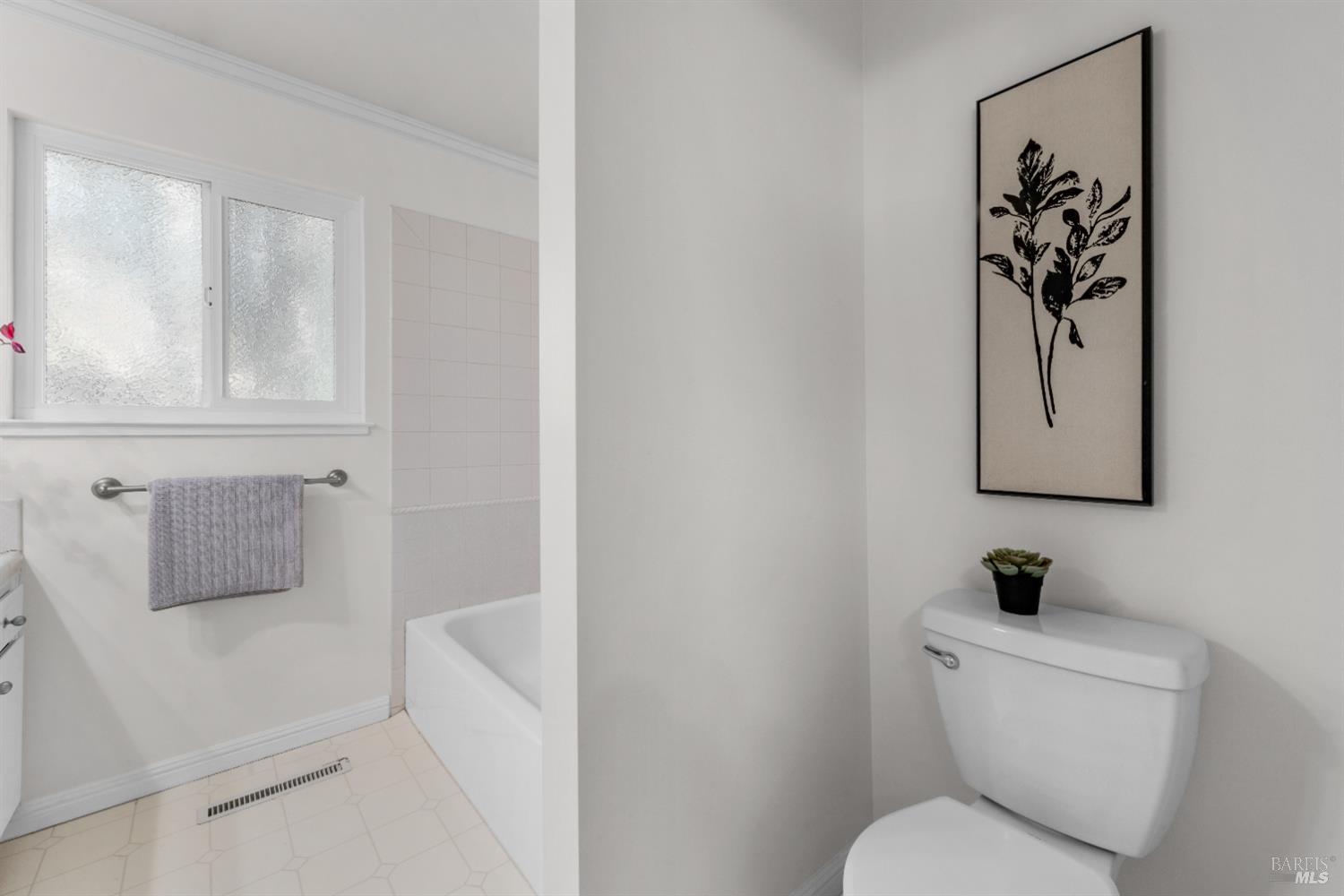 3996 Young Avenue Napa, CA 94558 - Photo 25 of 48 a white toilet sitting next to a bathroom sink