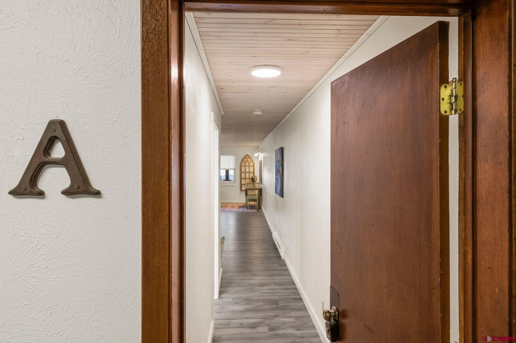 35 Emmons Road, Unit A Crested Butte, CO 81225 - Photo 27 of 28 a view of a hallway with wooden floor and staircase