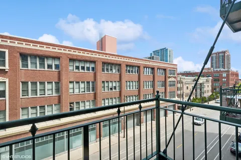 a view of a brick building from a balcony