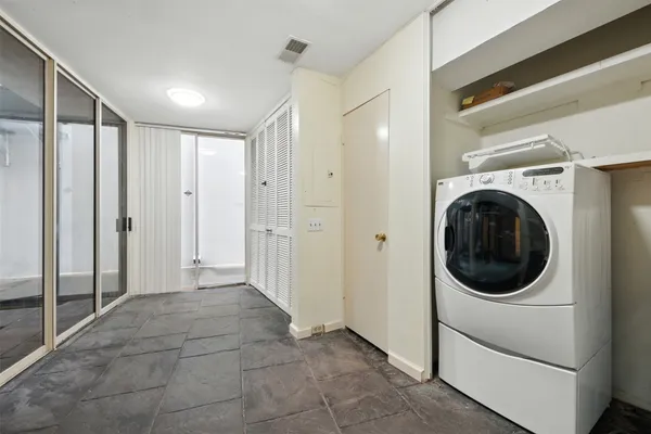 a view of a hallway with washer and dryer