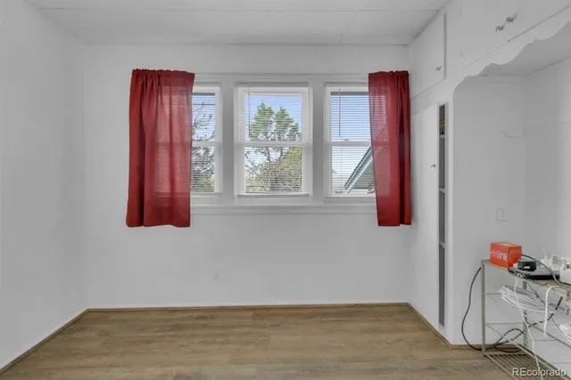a view of an entryway with wooden floor and windows