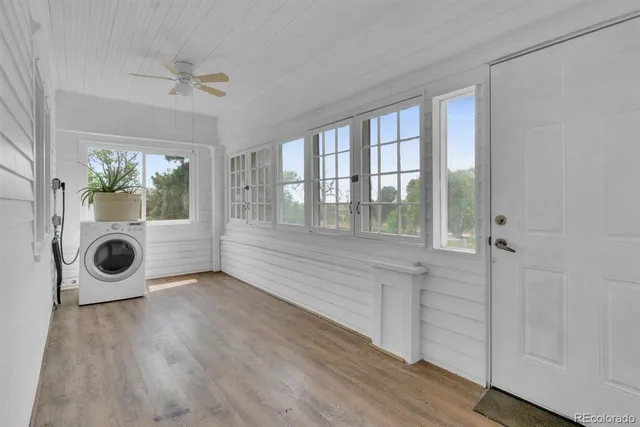 wooden floor in an empty room and a window
