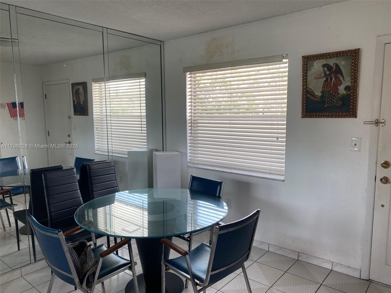 1400 Southwest 27th Avenue, Unit 202 Miami, FL 33145 - Photo 11 of 34 a view of a dining room with furniture and window