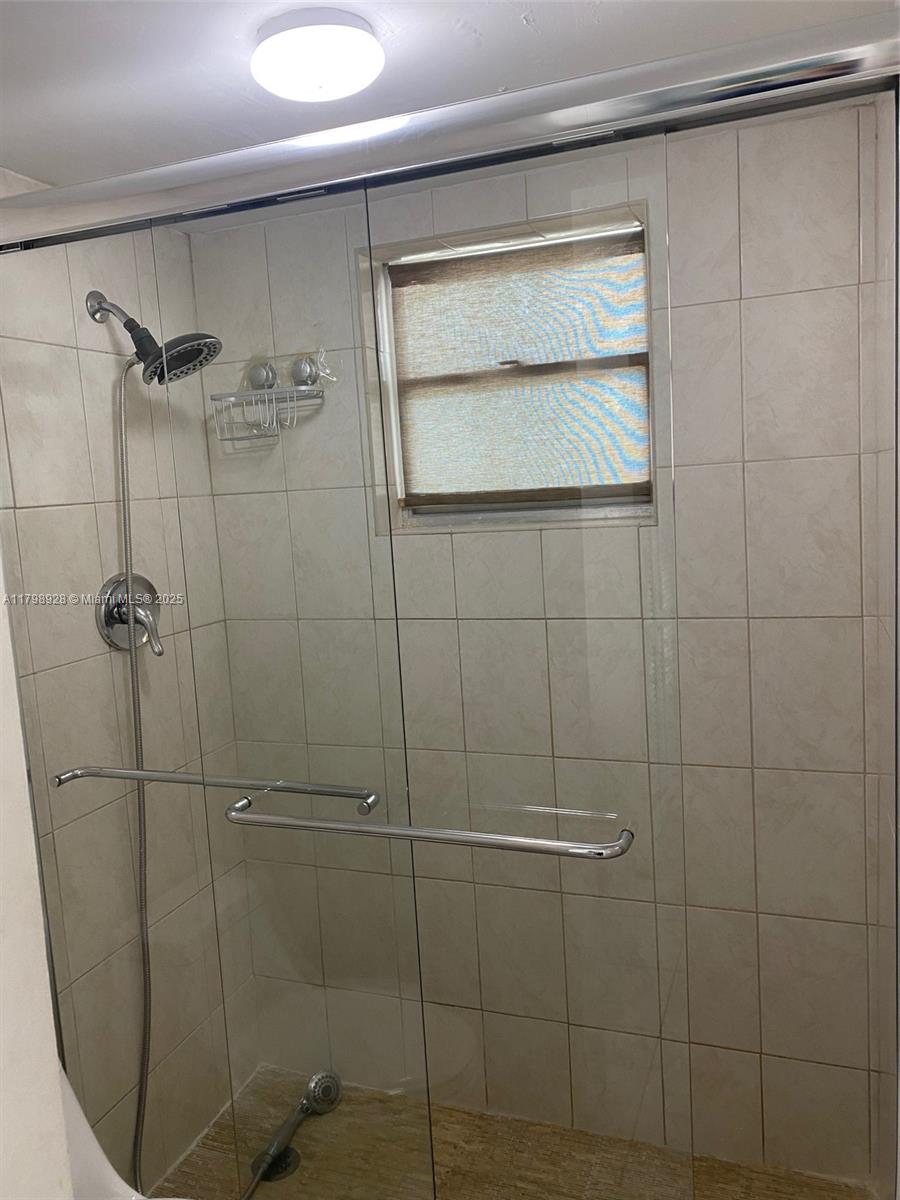 1400 Southwest 27th Avenue, Unit 202 Miami, FL 33145 - Photo 21 of 34 a bathroom with a shower