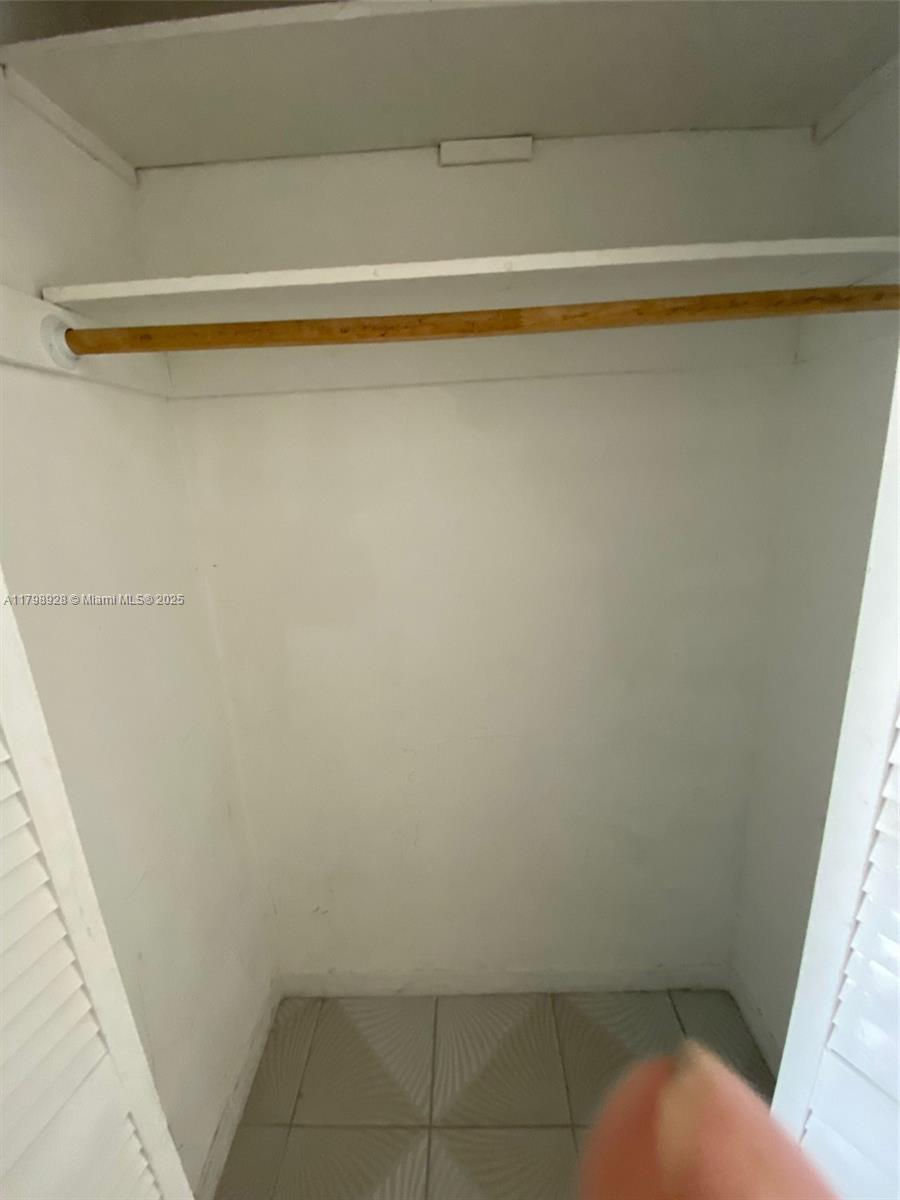 1400 Southwest 27th Avenue, Unit 202 Miami, FL 33145 - Photo 22 of 34 a view of a closet with a small space