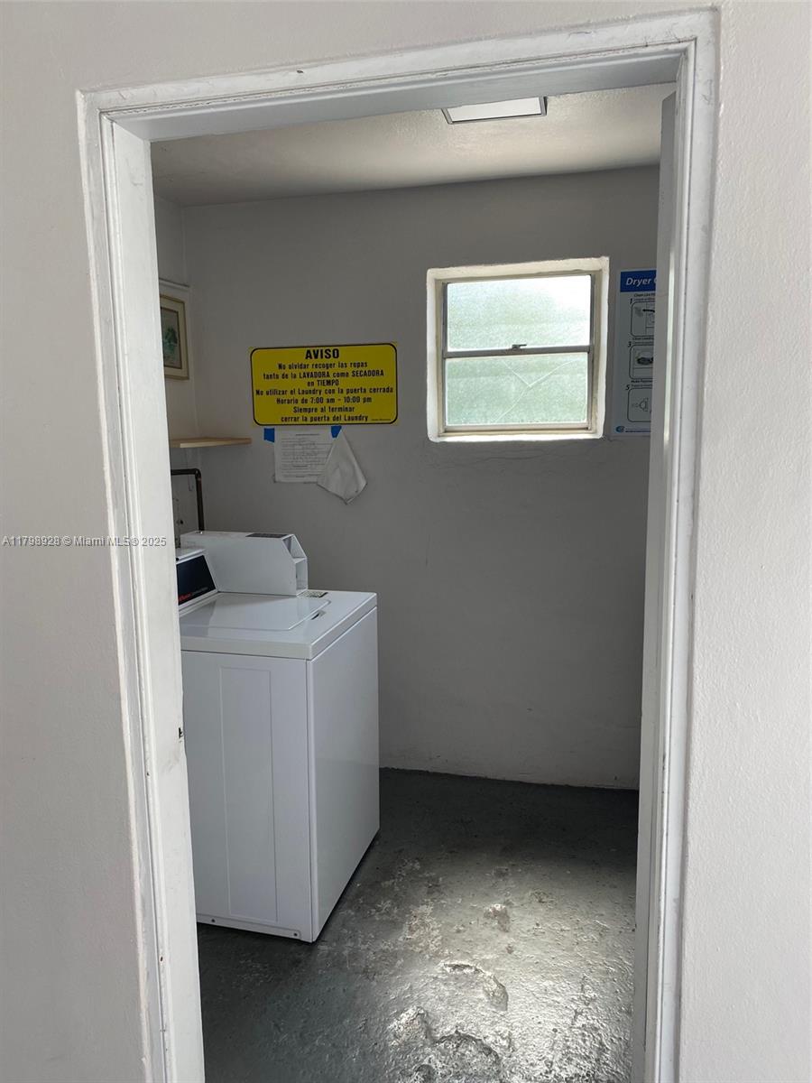1400 Southwest 27th Avenue, Unit 202 Miami, FL 33145 - Photo 28 of 34 a utility room with dryer and washer
