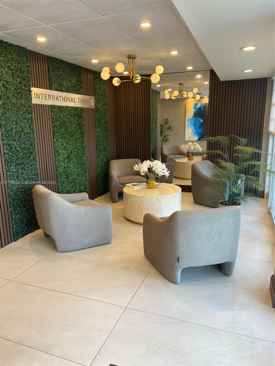 1400 Southwest 27th Avenue, Unit 202 Miami, FL 33145 - Photo 3 of 34 a living room with couches and kitchen view