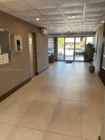 a living room with furniture and a painting